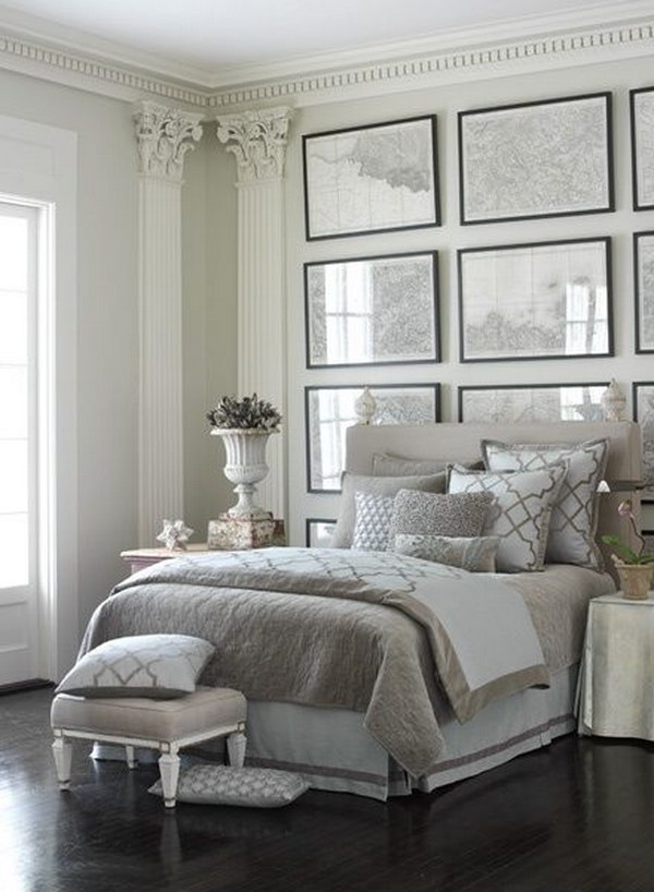 Luxe gray and white bedroom with frame wall decor. 