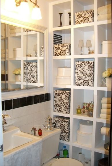 Great idea to put an open bookcase against an empty wall in the bathroom and use it for extra storage. 
