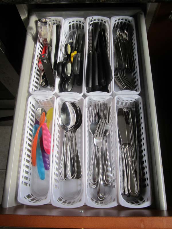 Dollar store bins cutlery drawers organization. 
