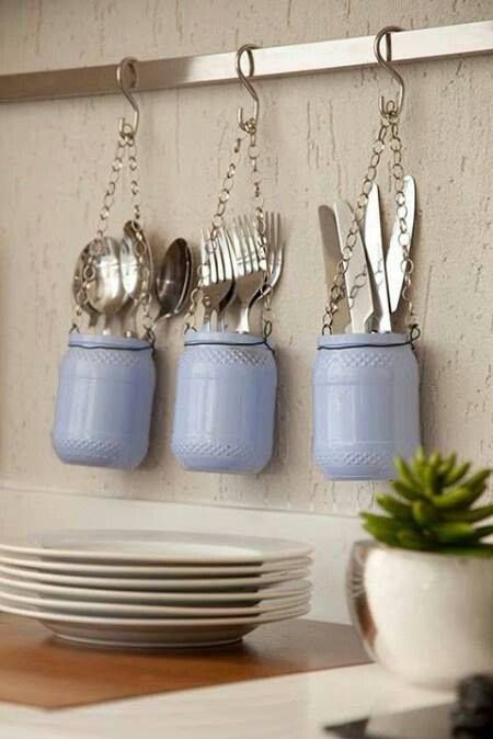 Hanging kitchen utensil holder with mason jars. 