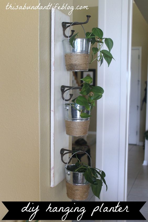 DIY hanging planter with dollar store buckets. 