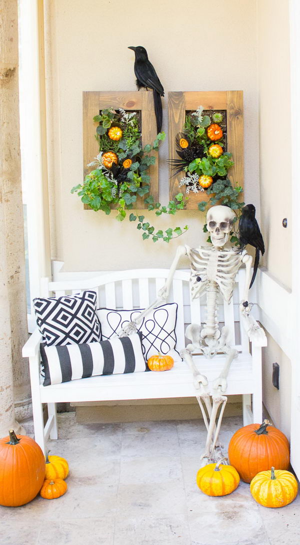 Creepy Halloween veranda with raven and skeleton. 