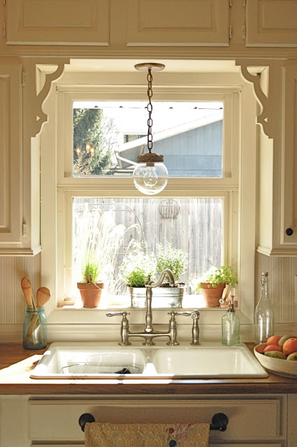 Country kitchen window treatment with consoles. 
