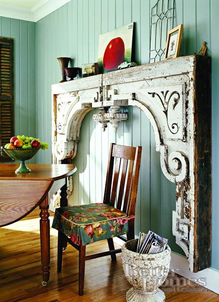 Make a fireplace cladding from two very large wooden brackets. 