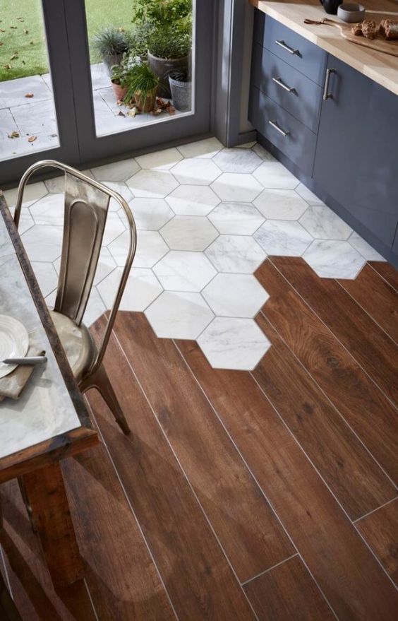 Transition from hexagon tiles to hardwood floor. 