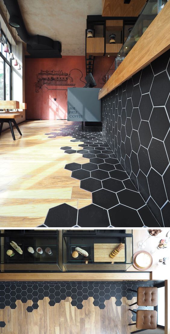 Transition of the black hexagon tiles to wooden floors. 