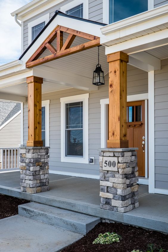 Rebuild your porch pillars with wood and stone. 