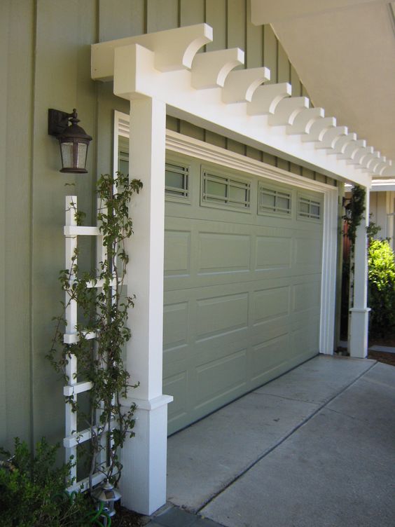 Add character to the garage, with the arbor painted to match the house cladding. 