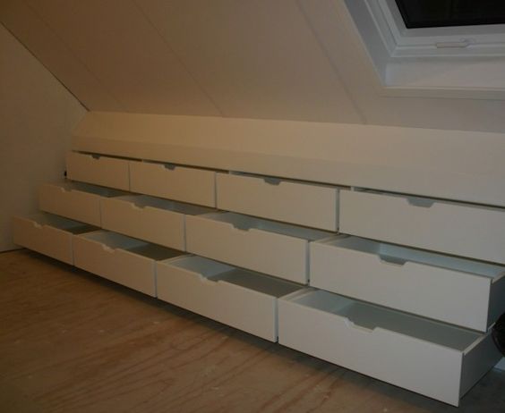 Find space in the attic with a drawer bench built into the eaves. 