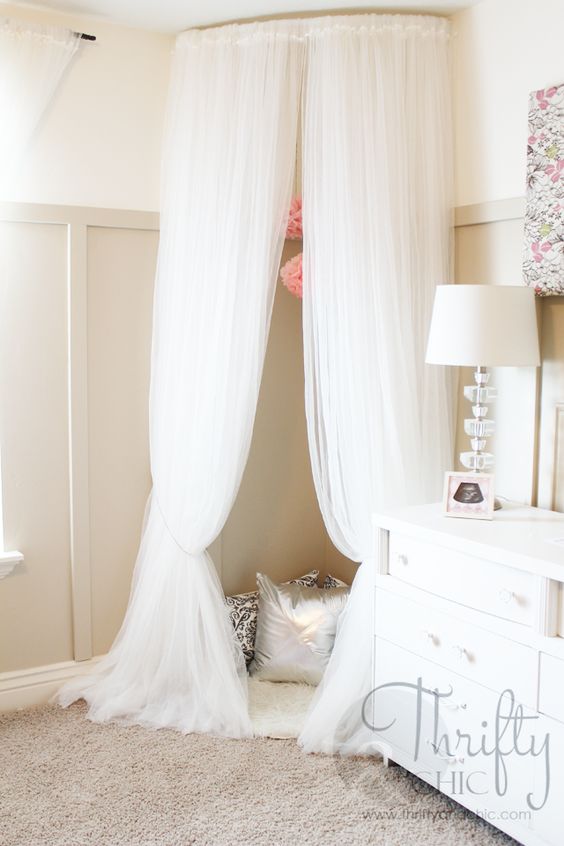 DIY quirky canopy tent or reading corner made from curved curtain rods and $ 4 Ikea curtains. 