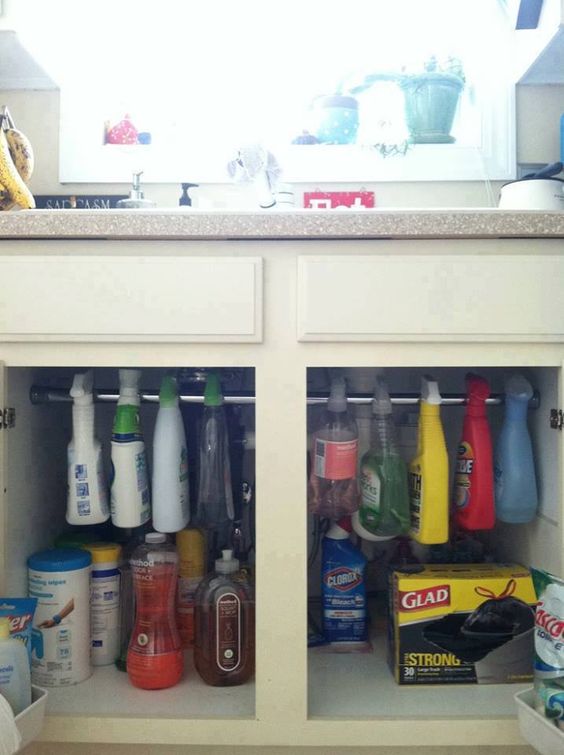 Hang detergent under the sink with a tie rod. 