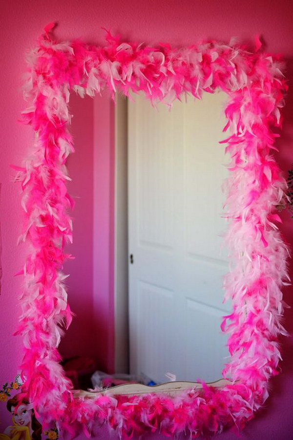 Feather boa on old framed mirror for princess dress up area 