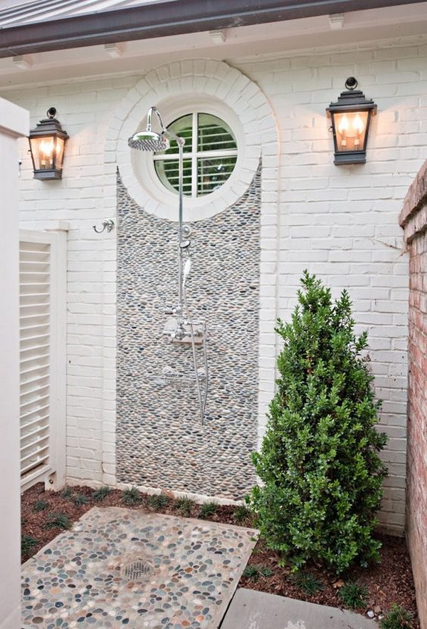 Outside shower with pebble wall. 