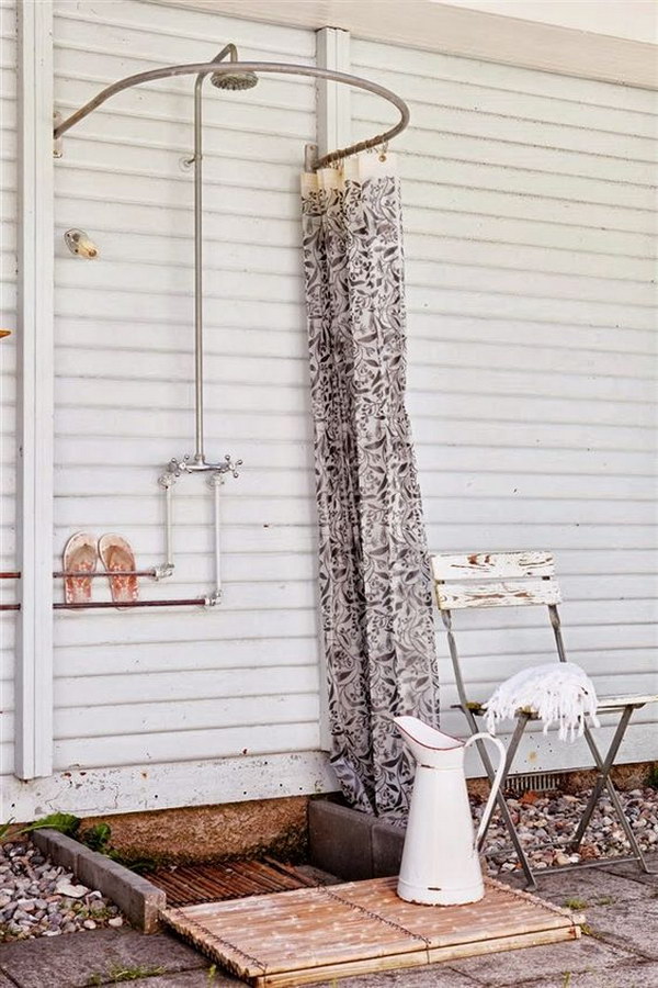 Simple outdoor shower with curved shower curtain rod. 