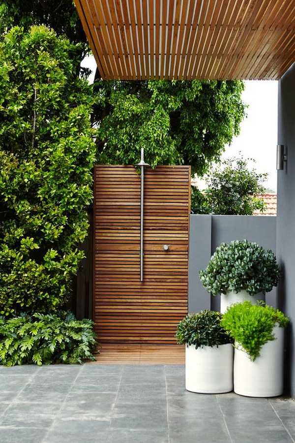 Wood-paneled outdoor shower. 