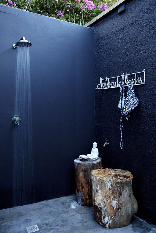 Cool and relaxing outdoor shower with stump stools. 