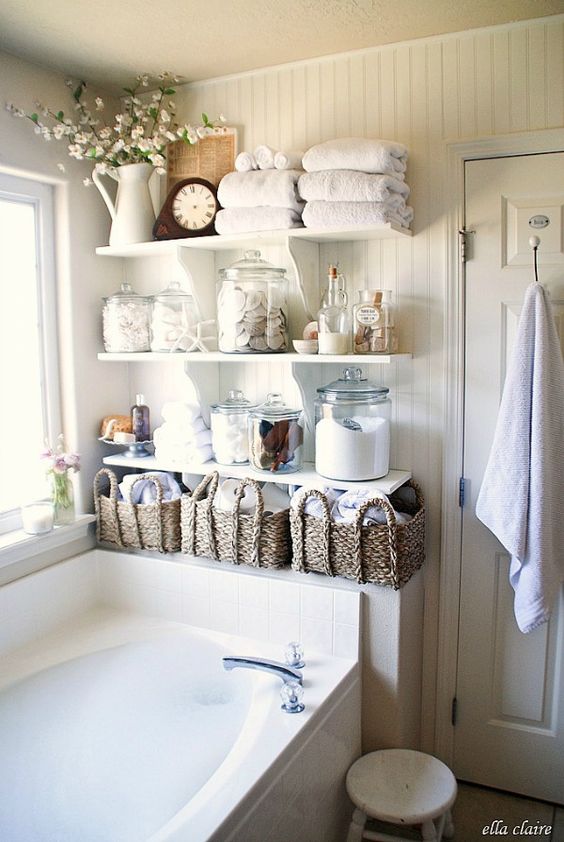 Vintage chic bathroom with DIY plank wall and open shelves