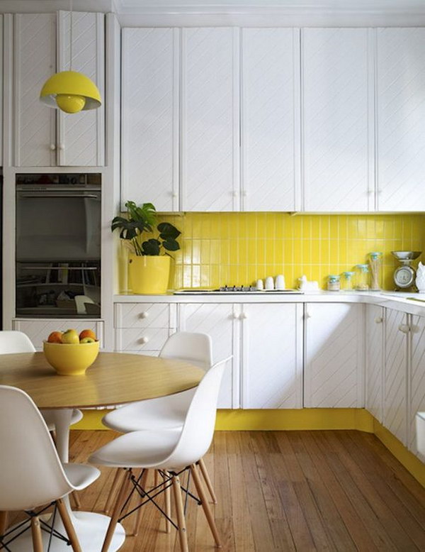 Yellow Subway Tile Backsplash against the sleek white cabinets