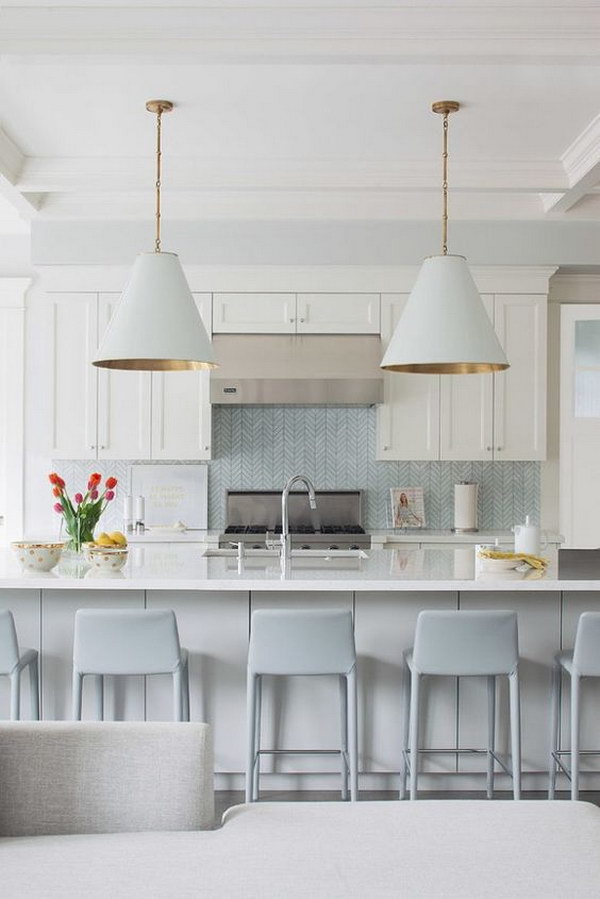 Light blue chevron tile backsplash in a modern coastal kitchen 