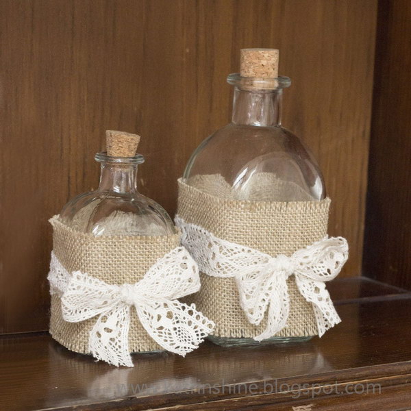 Shabby chic bottles decorated with burlap and lace