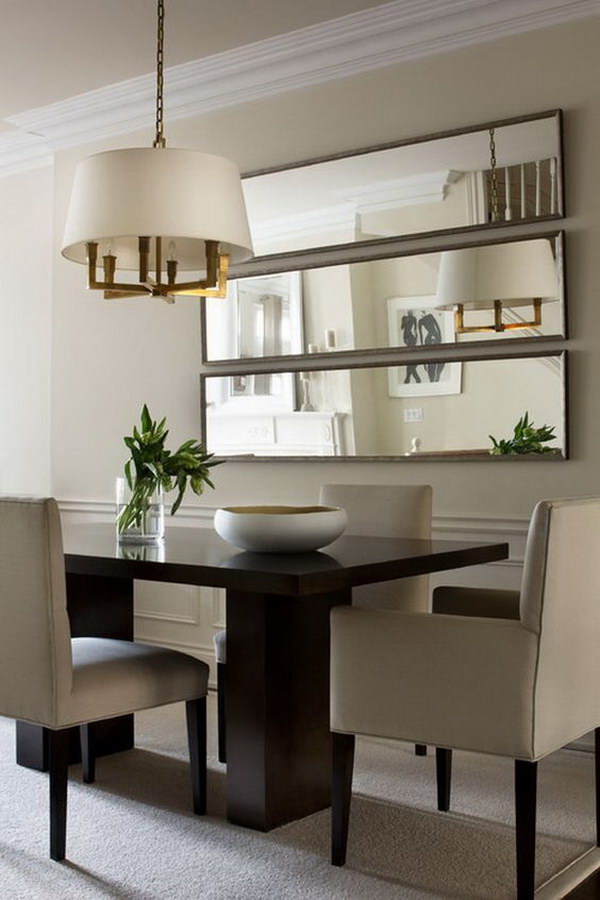 Small dining room with wall mirrors. 