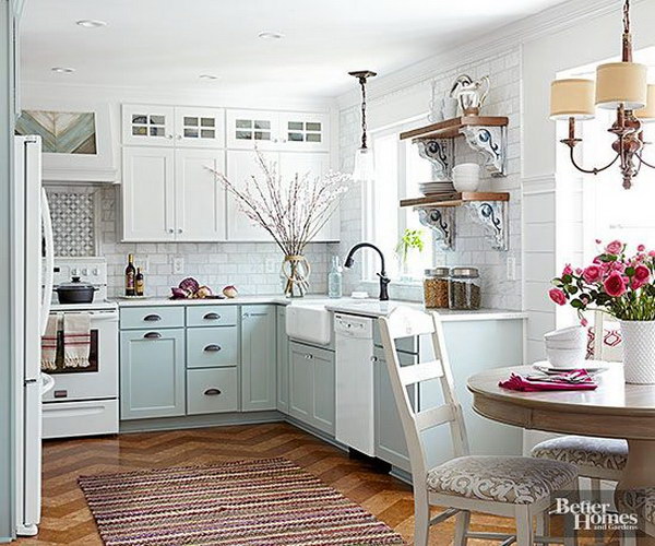 Pastel blue and cream-colored kitchen cabinets. 