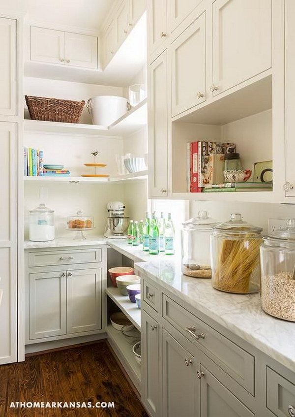 Two-tone kitchen pantry with cream-white and gray cabinets. 