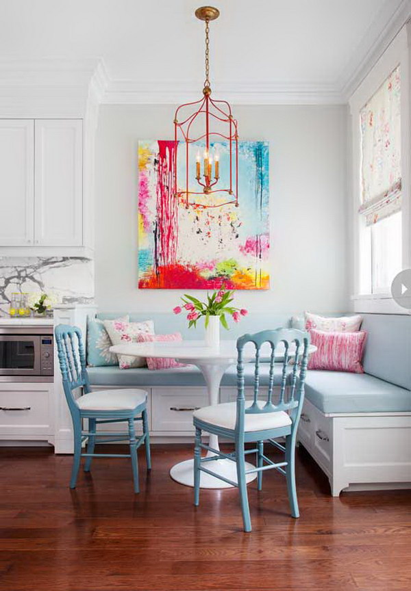Beautiful breakfast nook with a colorful artwork. 