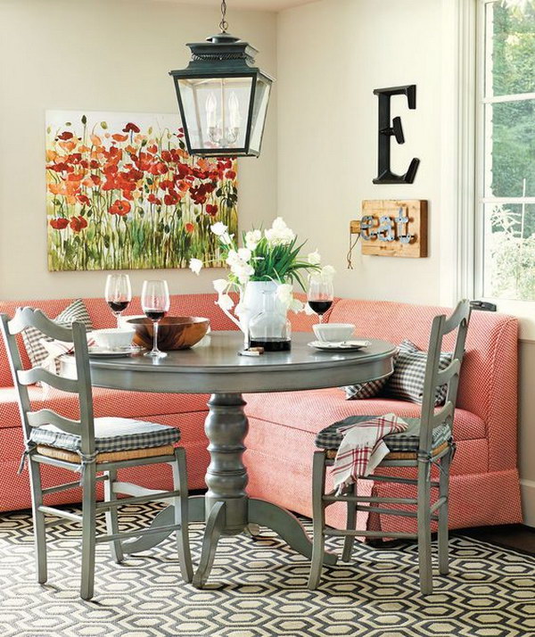 Stylish breakfast nook with red banquet armchairs. 
