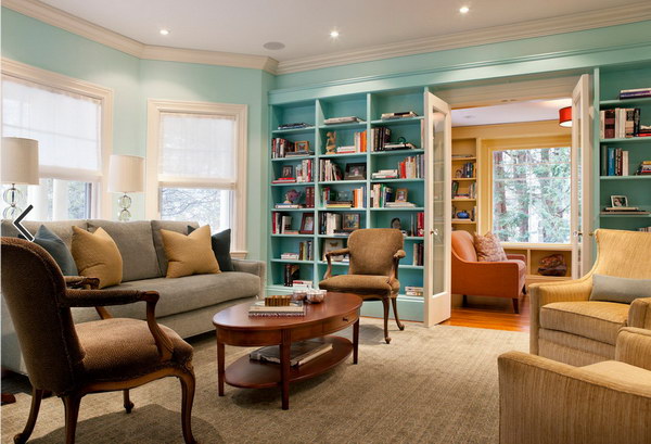Blue painting living room with bookcase. 