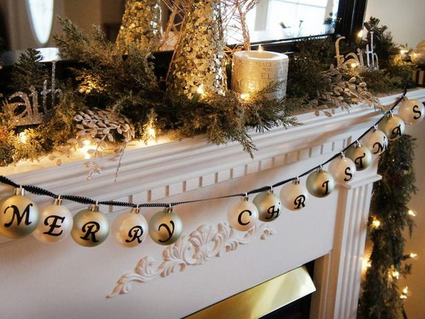Place letter stickers on ornaments and attach them with a ribbon for the mantelpiece decoration 