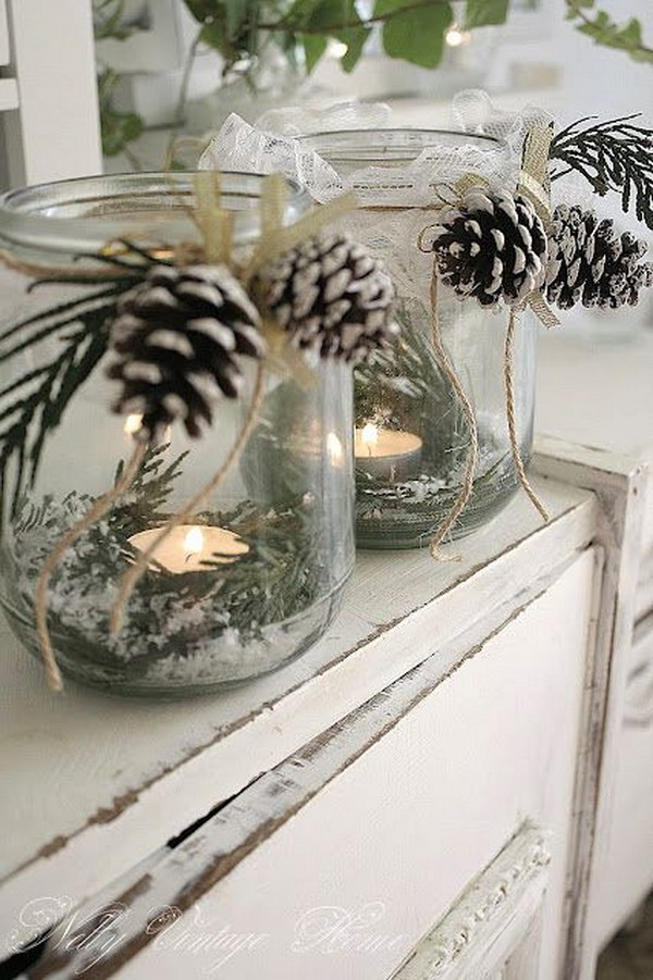 Glass glass candle holder with artificial snow, green and pine cones 