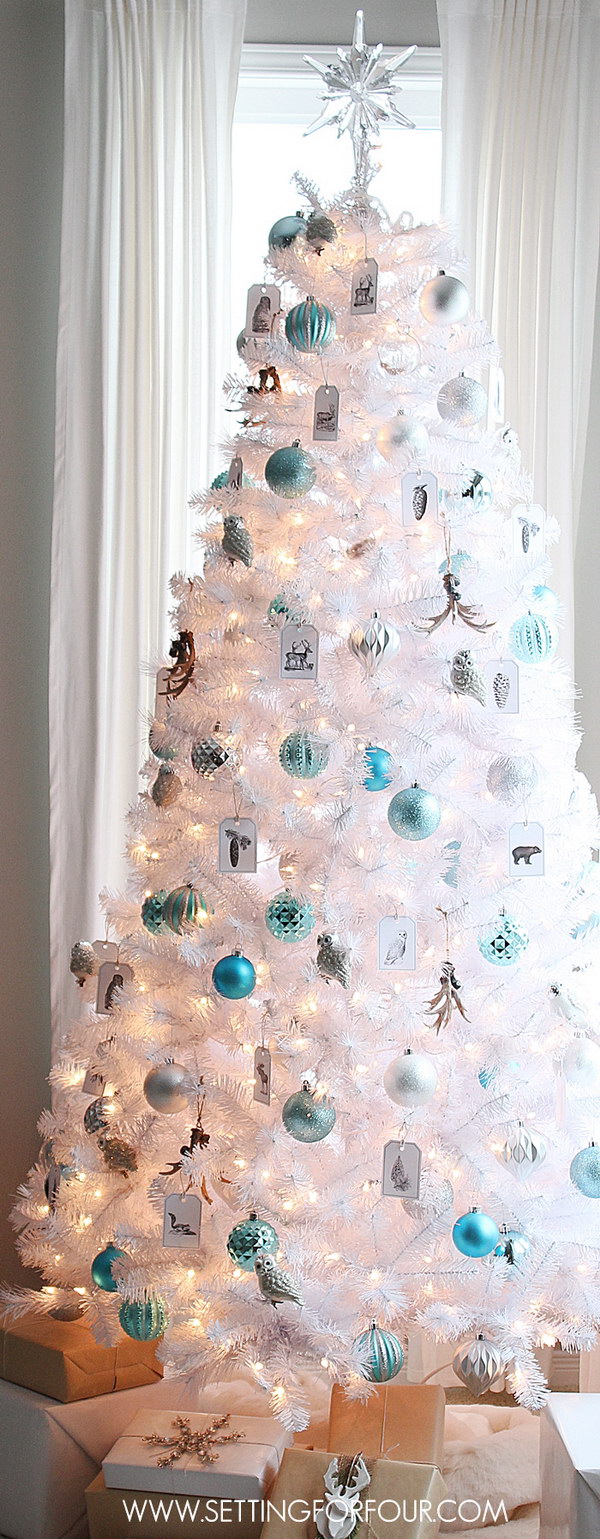 White Christmas tree with silver and blue decorations 