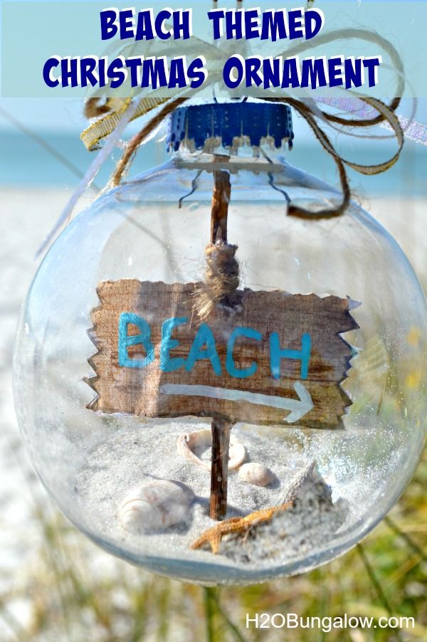 DIY beach themed Christmas tree ornament with shells, sand and starfish on the inside 