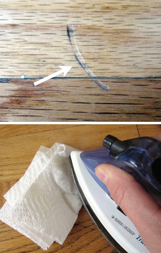 Use an iron and a damp cloth or paper towel to repair the dents in wood. 