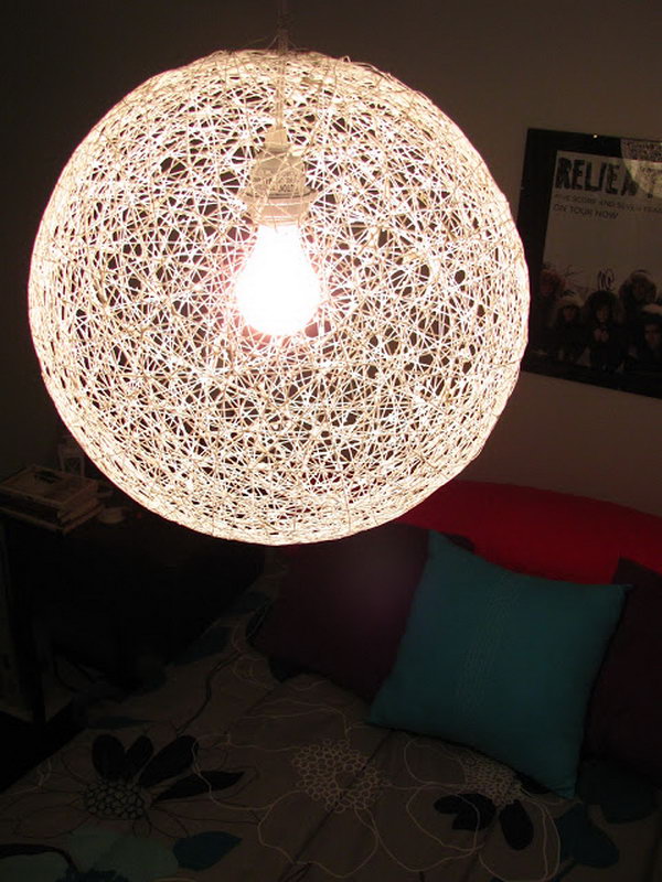 DIY string chandelier made of a bouncy ball and yarn. 