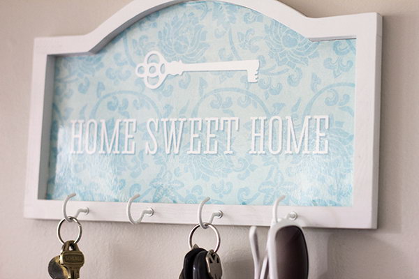 Sweet and simple key holder. This wall piece is cute and easy to make. The components are simple: a shaped piece of wood, hooks and some patterned wrapping paper for the aesthetic part. The finished product looks wonderful with or without a key. See the tutorials 