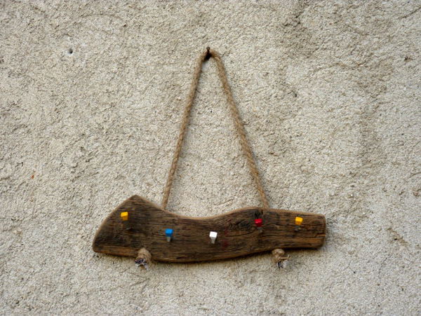 Wall hanging wooden key holder. This key holder idea requires very little effort. Simply attach a few colorful hooks to a piece of old solid wood, then hang it on the wall with a rope and you have a nice and functional key holder. See more 