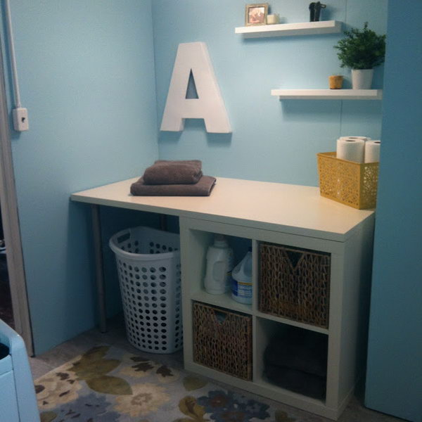 Laundry area. This clean white IKEA Kallax shelf is the perfect place to put your laundry together as well as for organized storage. You do not have to reserve a special area for it. See the full instructions  
