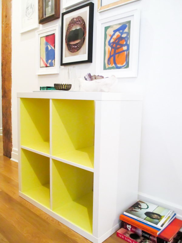 DIY Kallax shelf in neon yellow. Super easy to use contact paper to upgrade your simple IKEA Kallax parts. Look at that in neon yellow. Isn't it just the amazing thing? See the full tutorial 