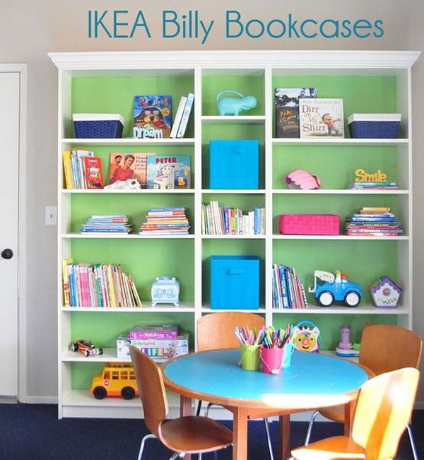 Beautiful IKEA BILLY bookshelves for children. Good transformation by painting the back in green and adding molded parts for the simple BILLY bookcase. This is perfect for the playroom! 