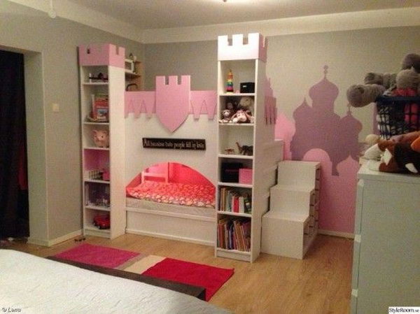 Castle bed with upper play deck with an IKEA Kura bed and two BILLY bookcases. For more information, see 