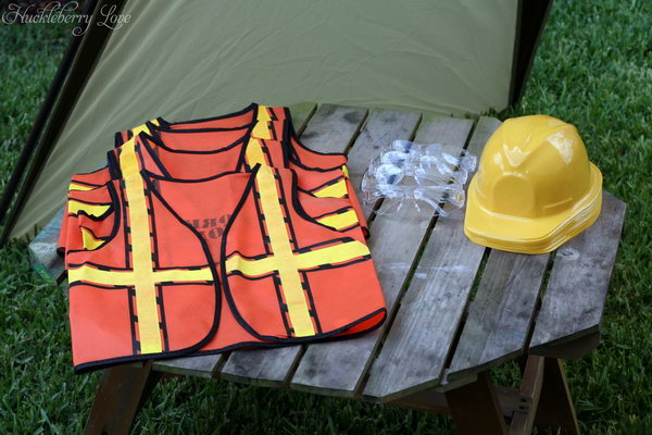 Kids Construction Clothing: construction vest and protective helmet. 