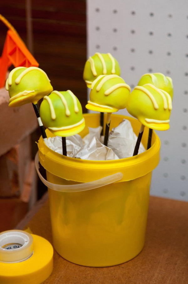     Cute Hard Helmet Cake Pops: What cute Hard Helmet Cake Pops. They really promote the building theme. 