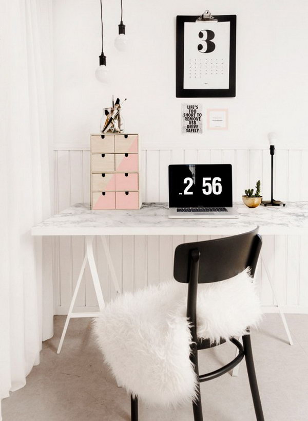 A desk made of artificial marble. Another clever DIY desk. The marble paper table top, available at hardware stores or online, gives this simple IKEA desk a luxurious look. 