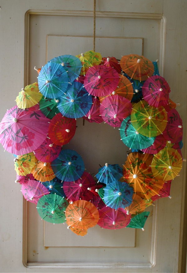 Paper umbrella wreath. Paper cocktail umbrellas or umbrellas are available in party shops. You can collect them and do this craft. It looks so wonderful in your children's door.