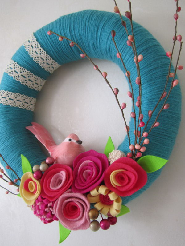 Pink bird teal wreath. This jug made of blue-green bird yarn is super beautiful and adorable. It is the favorite of most girls. It is a perfect decor for your daughter's room. 