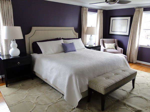 Purple-blue-white decorative bedroom: I love how they combine an abundance of dark purple with warm neutrals and light for a certain contrast. The black furniture really bursts the white lamps and other objects.