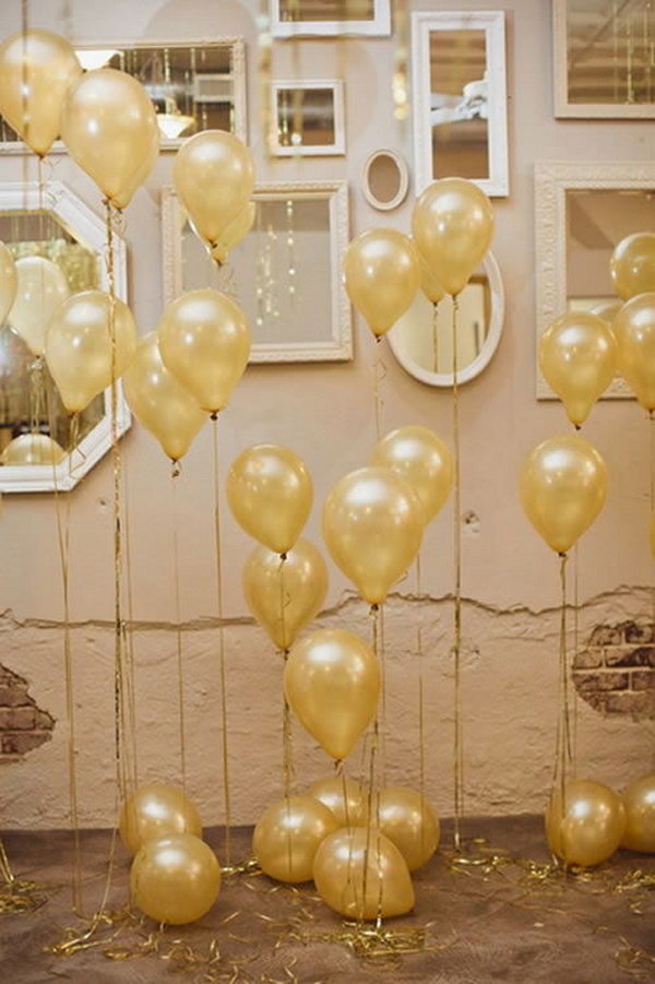     Start the wedding arrangement with helium balloons that have golden ribbons and mirrors tied to the wall in the room. That is super divine. 