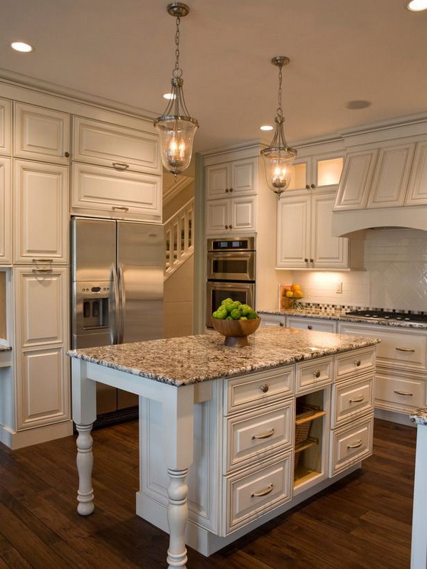    Cottage White Island. This marble island fits very well in the kitchen. I love the doors and the marble. Also love the beautiful classic white cabinets. 